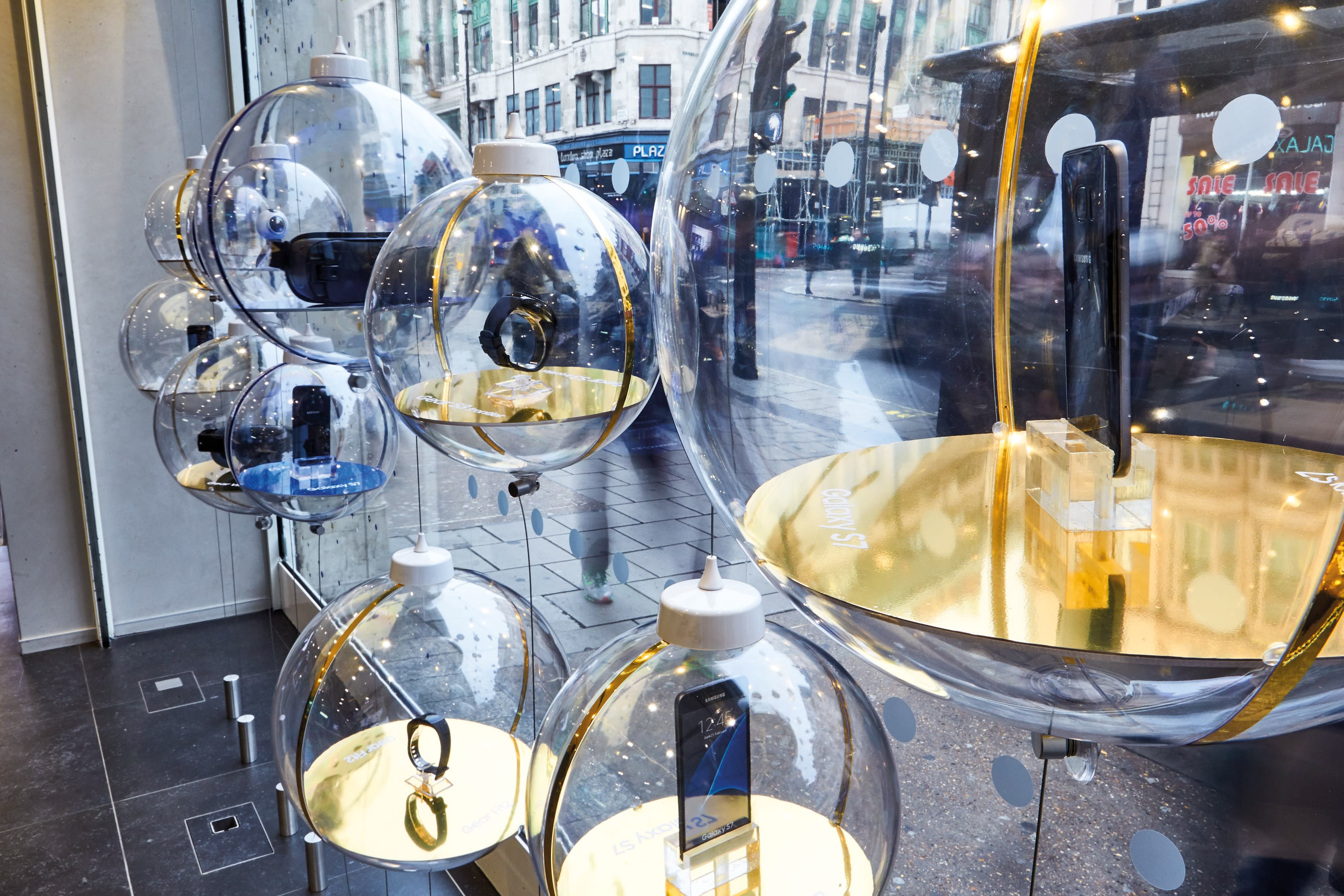 Glass baubles containing phones
