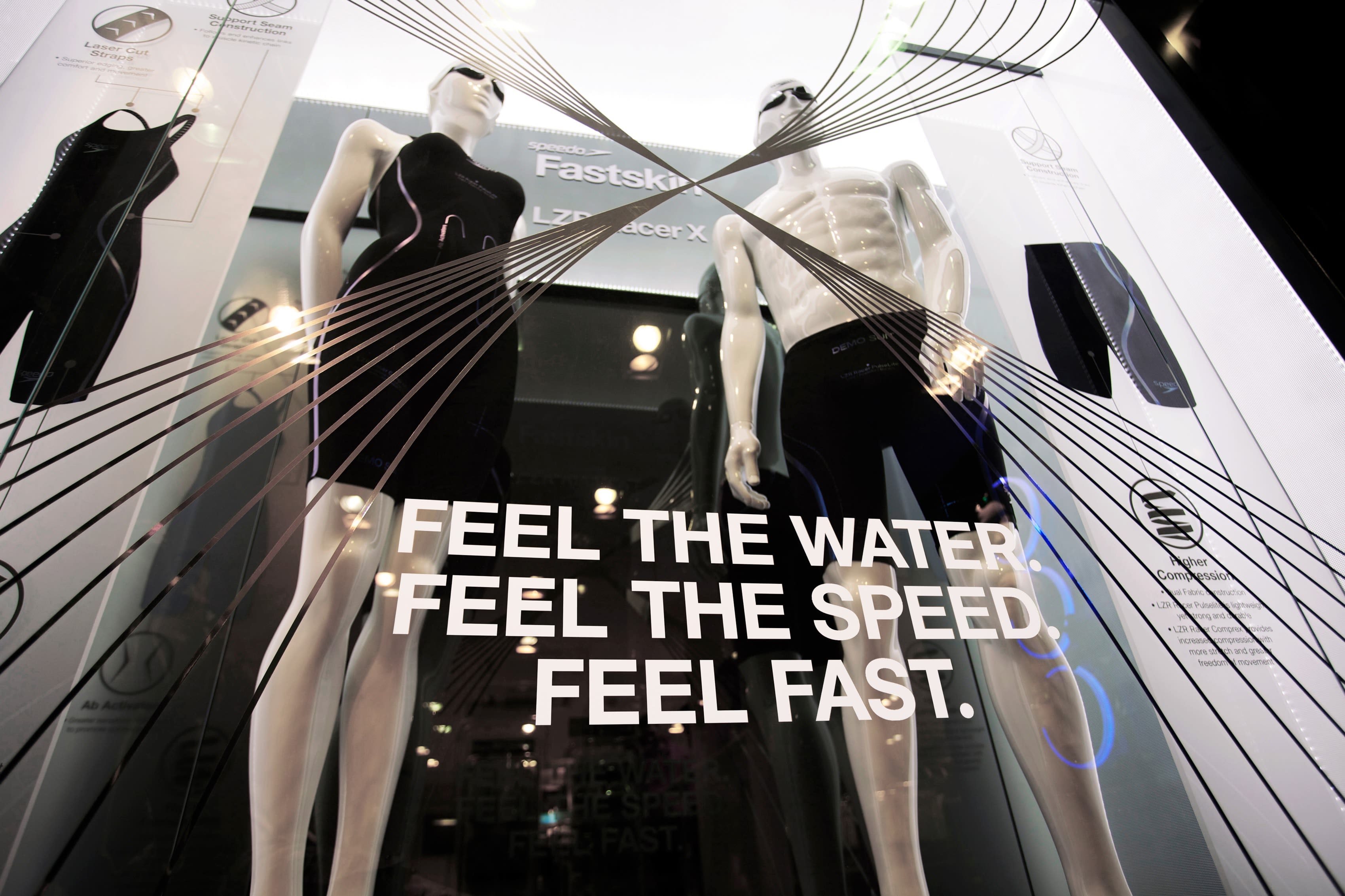 Shop window with swimsuit manikins