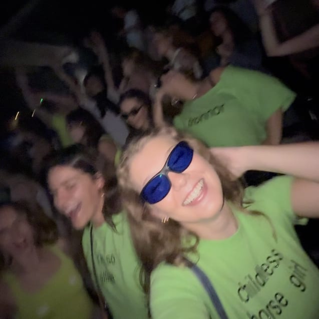 Faith wearing TheraSpecs Z-Blue glasses in wraparound frame at concert
