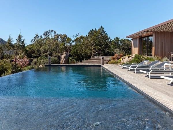 The gorgeous pool is surrounded by a large decked terrace on three sides.