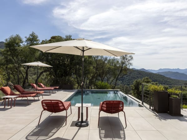 Relaxing by Casa Bisua's panoramic infinity pool.