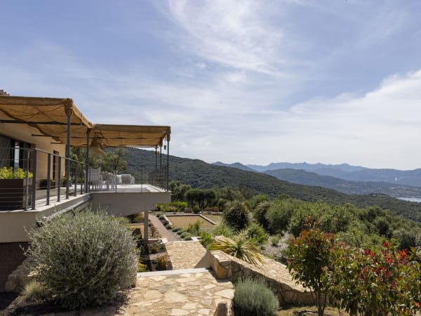 The main terrace runs along the entire façade of the house and round the sides too.