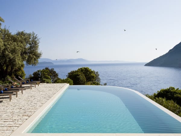 Akrothea's incredible infinity pool overlooking the sea and islands.