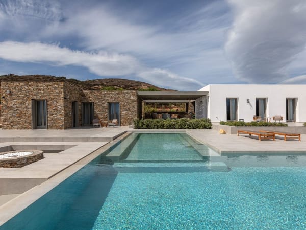 The main house (on the right) and the guesthouse (on the left) are separated by a series of well-shaded al fresco areas.