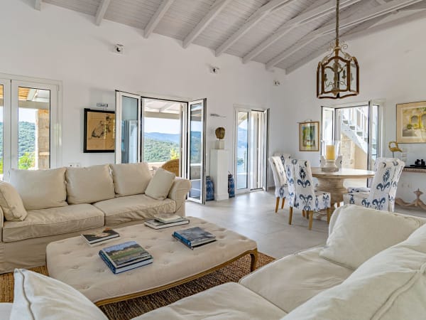The luminous living and dining area on the upper level of the house.