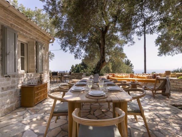 The shady al fresco dining area with the sea on the horizon.