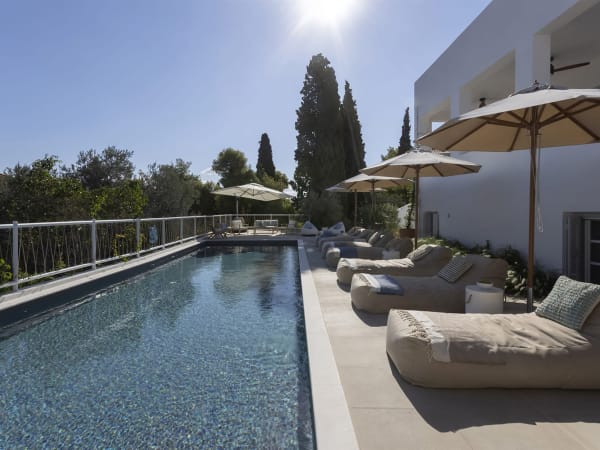 Relaxing by Catrine's enticing pool.