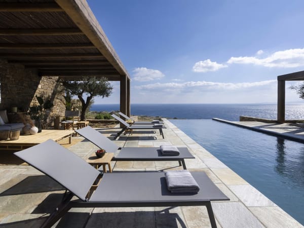 Enyalos's sleek infinity pool appears to merge with the sea.