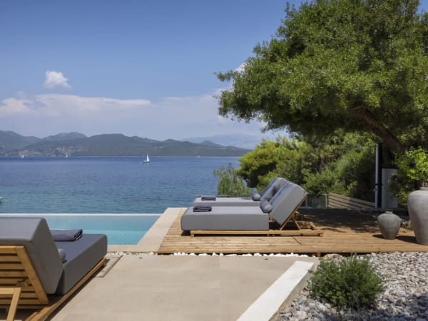 Lounging by Eolia's infinity pool admiring the views.