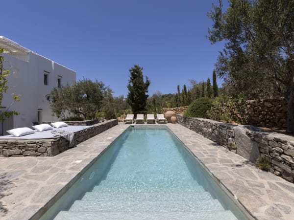 The pool terrace hosts one of the property's lounge areas as well as an al fresco dining area.