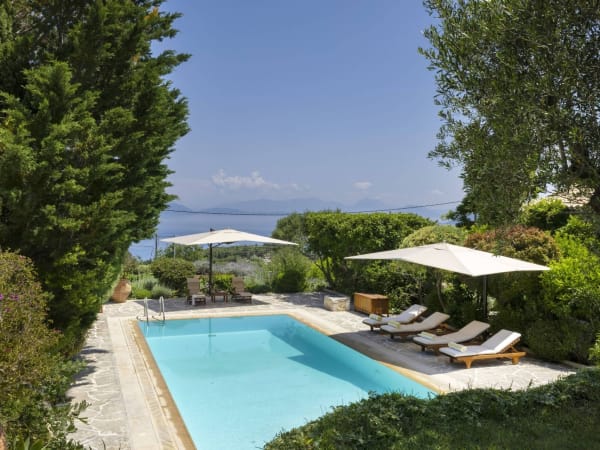 The pool terrace is flanked by a colourful and fragrant assortment of plants, trees and flowers.