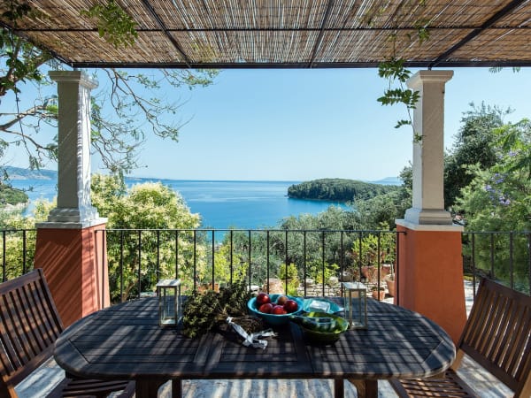 The main dining terrace overlooks the pool and the sea.