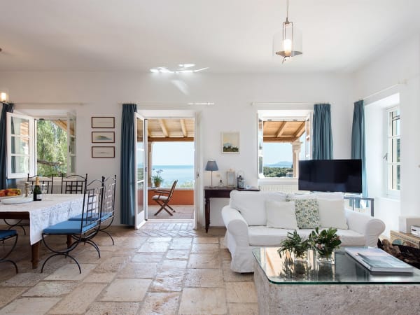 The living and dining area opens out onto the al fresco dining area.