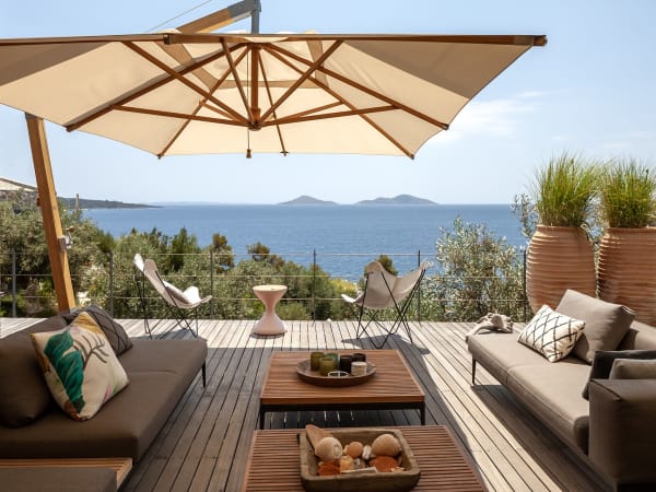 The beautifully furnished terrace outside the main house's living and dining area. 