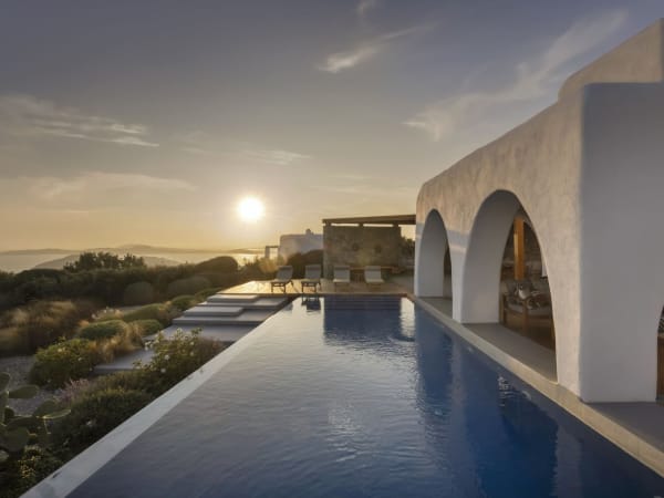 The sun begins its descent over Noera's beautiful infinity pool.