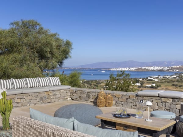 A well-furnished al fresco sitting area - the perfect spot from which to take in the views.