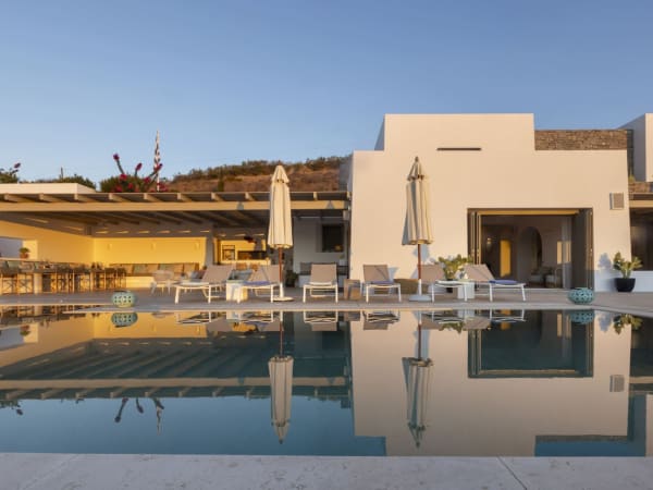 Palmyra's graceful façade reflected in the pool.