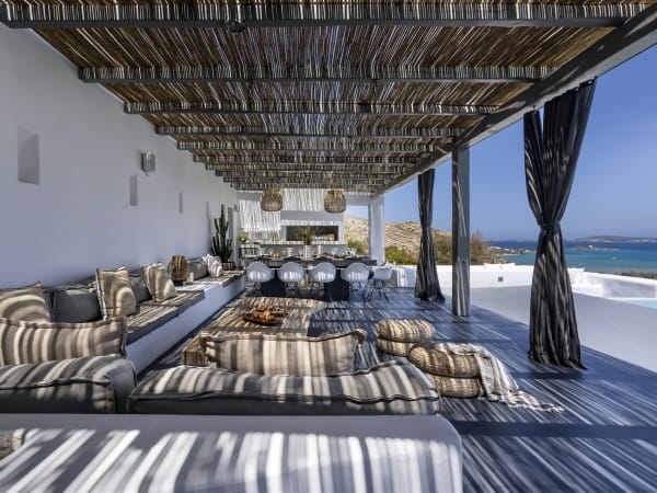 The convivial al fresco dining area, served by an outdoor kitchen with barbecue.