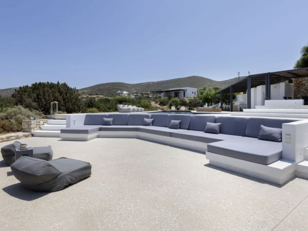 The convivial. comfortably cushioned lounge area below the pool.