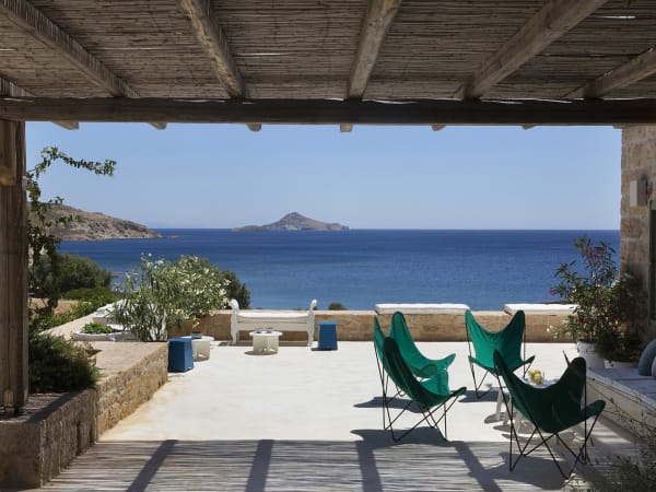 Shady terraces wrap around three sides of the house, offering plenty of space for al fresco living.