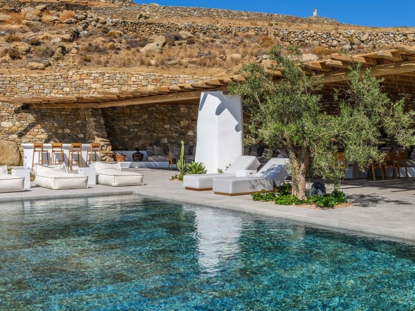 Back by the inviting blue-hued waters of the pool.