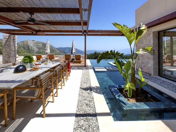 The well-shaded and sheltered al fresco dining area to the side of the house.