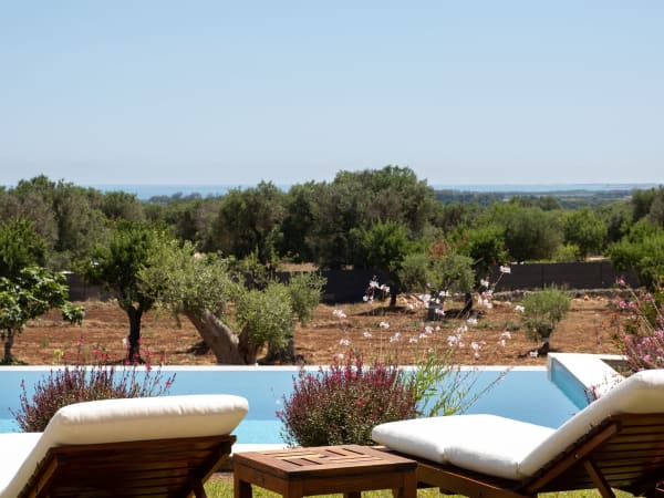 Choose your spot by the pool and soak up those views.