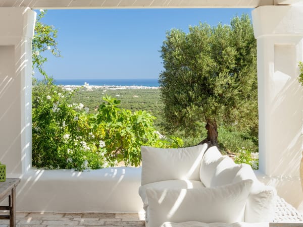 The main, shady terrace area with views down towards the sea.