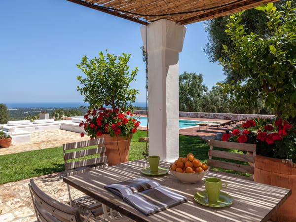 The shaded al fresco dining area overlooking the pool.