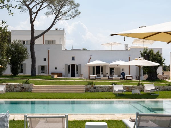 Verdant lawns, cerulean waters and the pristine white façade of Masseria Ciasca.