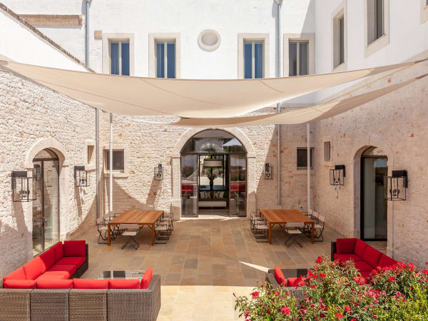 The shaded courtyard is accessed from hallway and the indoor living and dining areas.