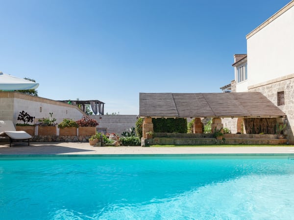 Looking from the pool to the al fresco dining area.