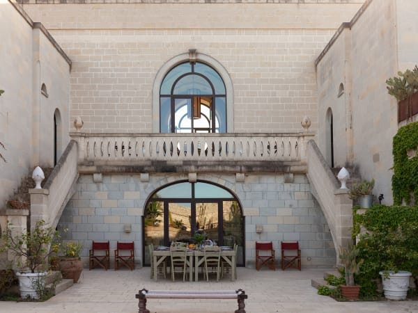 The east-facing side of the house with its secret sunken courtyard garden.