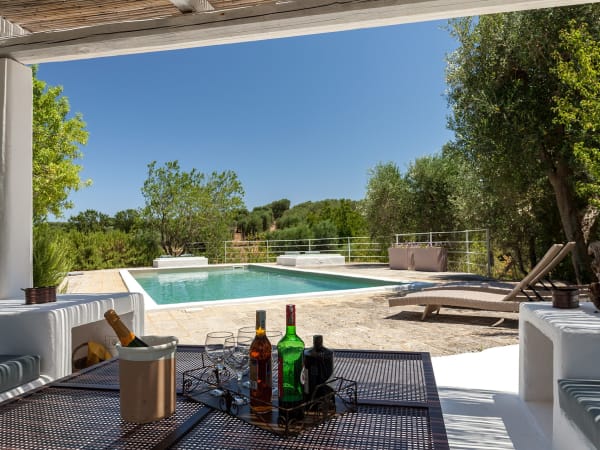 The shaded lounge area next to the pool.