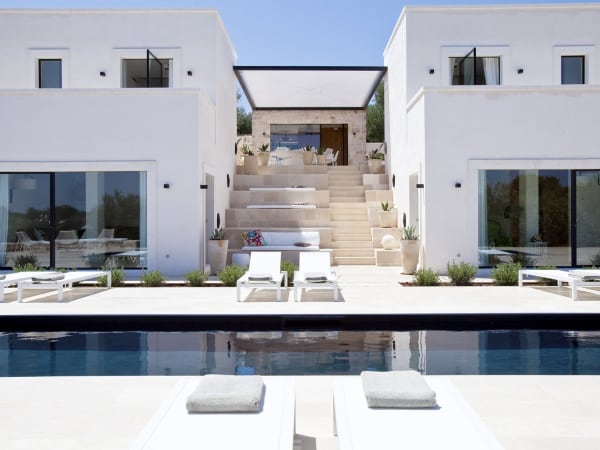 The French windows on the left access the living room, those on the right a bedroom.