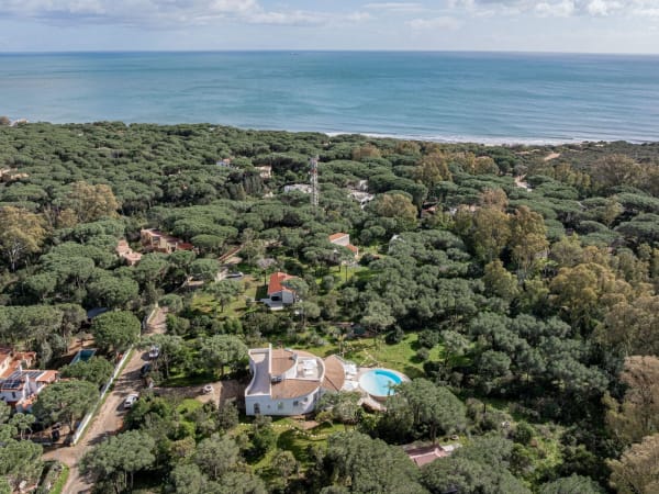 A bird's-eye view of Lia with the beach of Santa Margherita di Pula in the background.