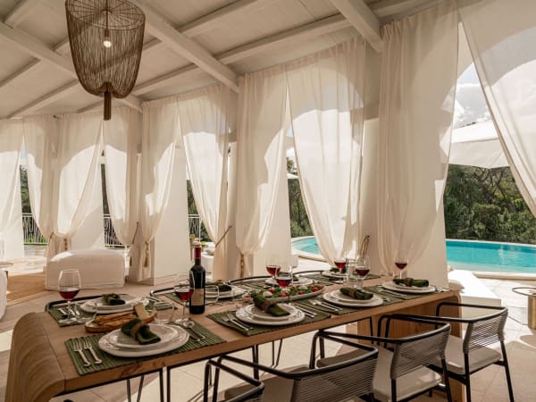 The shaded main terrace, accessed from the living area, hosts a space for lounging, dining and cooking.