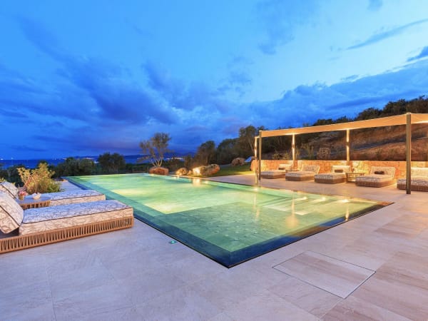 A magical atmosphere by the pool as dusk falls.