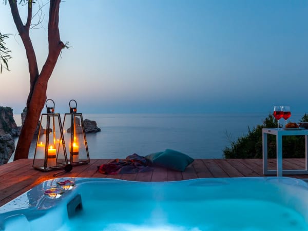 A magical crepuscular atmosphere by Ai Faraglioni's Jacuzzi.