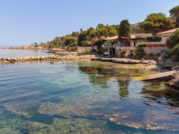 The limpid, serene waters of the Ionian Sea are just a few steps away.