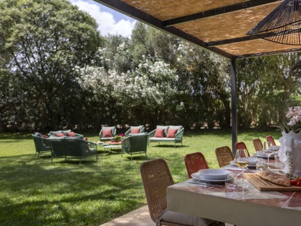 The dreamy al fresco dining area and a sitting area on the lawn. 