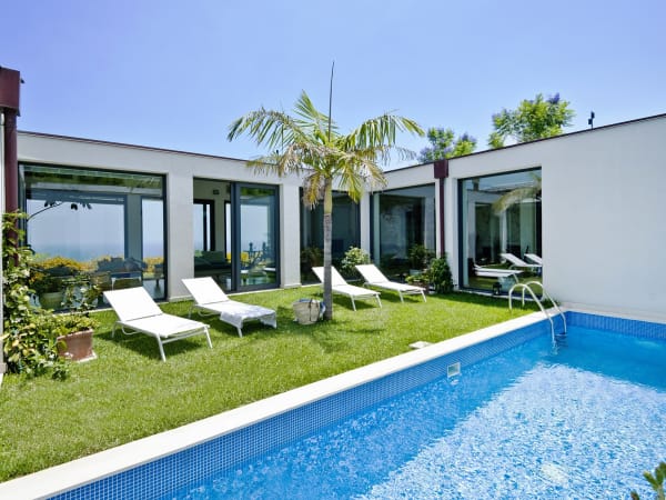 The internal courtyard pool has sea views via the living room windows.