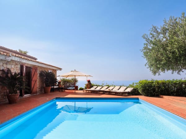 The entrance to the house seen from across the pool.