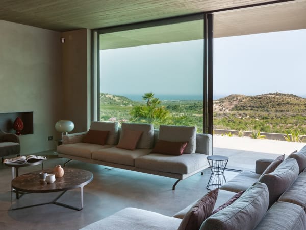 The bright, airy and panoramic living area with its wall of sliding glass doors.