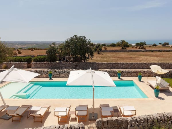 The irresistible pool and views out across the rolling farmland to the sea.
