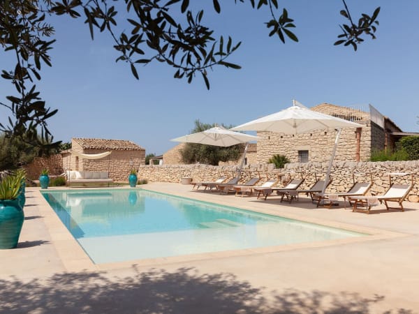 Masseria d'Estia rising above its gorgeous 15m-long pool.