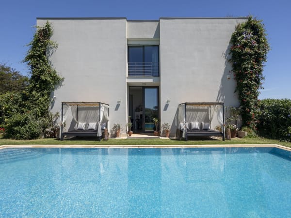 The pool is set in Ortensia's fragrant Mediterranean garden.