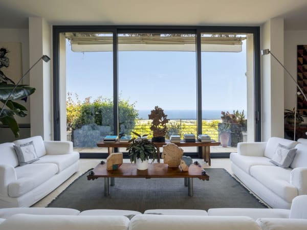 The living room at Ortensia opens out onto a large panoramic balcony.
