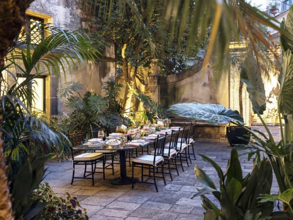 The leafy al fresco dining area in the first part of the secluded courtyard.