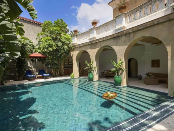 The gorgeous pool with its shady, comfortably furnished portico.